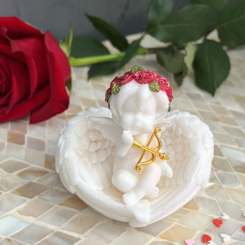 Handmade Cupid angel soap in clear gift box with ribbon
Cupid angel soap with gold bow and arrow Valentine’s Day gift
Decorative angel soap gift-ready packaging
