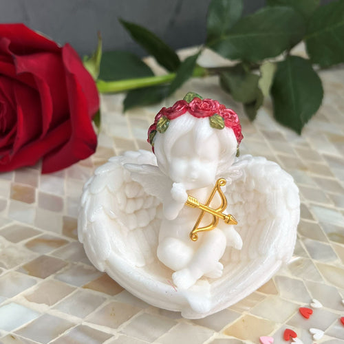 Handmade Cupid angel soap in clear gift box with ribbon
Cupid angel soap with gold bow and arrow Valentine’s Day gift
Decorative angel soap gift-ready packaging
