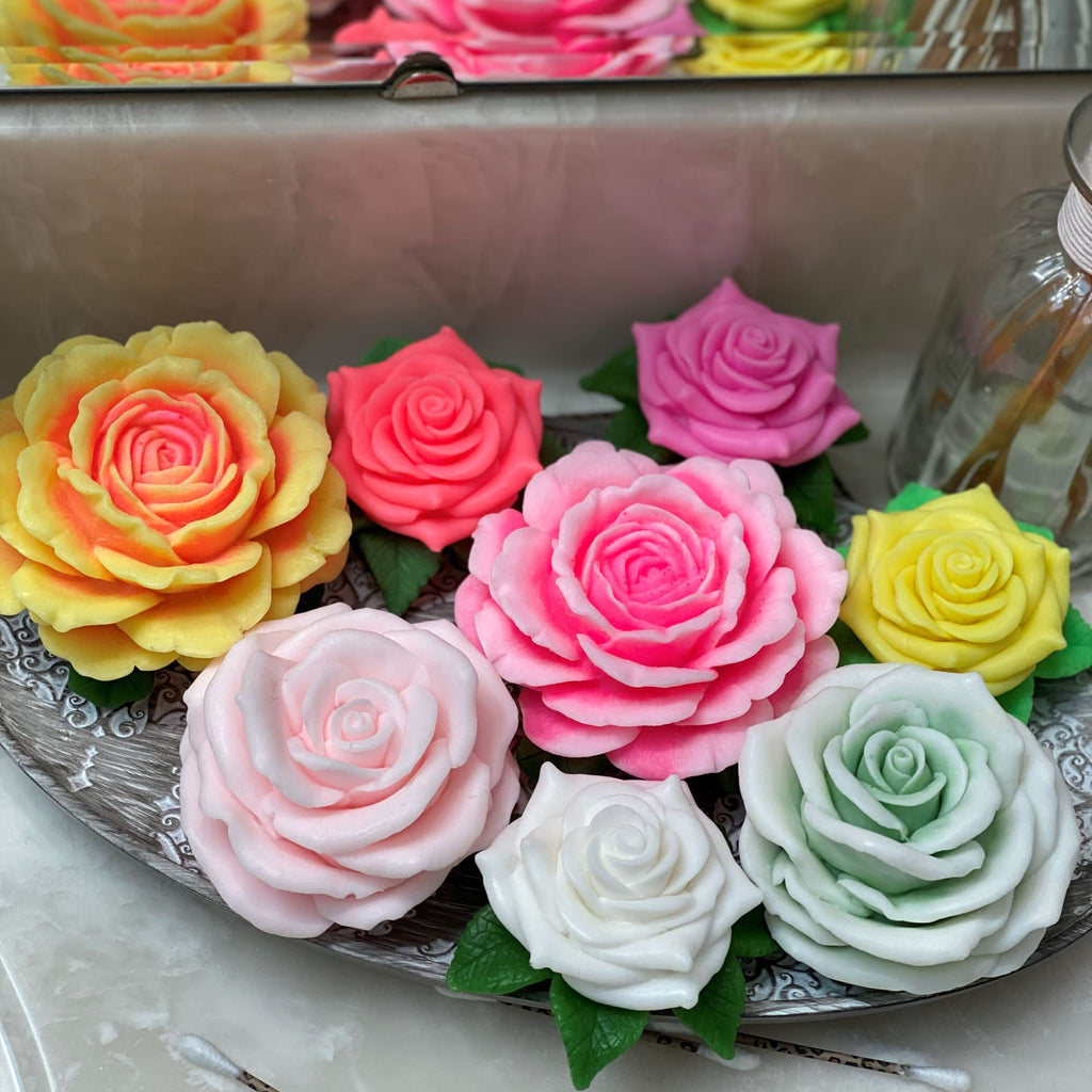 Colorful rose-shaped candies on a decorative plate with a blurred background.